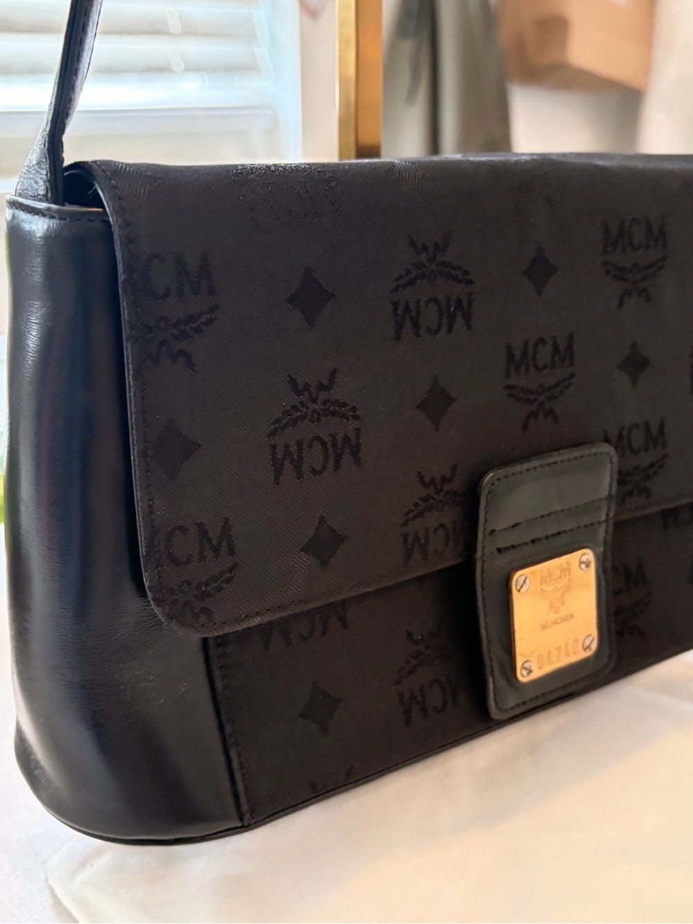MCM Black Leather Messenger Bag with Gold Hardware